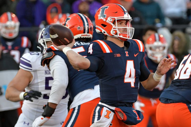 Nov 25, 2023; Champaign, Illinois, USA; Illinois Fighting Illini quarterback John Paddock (4) passes the ball during the first half against the Northwestern Wildcats  at Memorial Stadium. Mandatory Credit: Ron Johnson-USA TODAY Sports