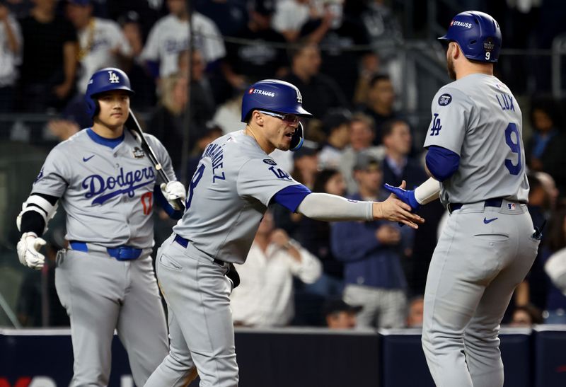 Oct 30, 2024; New York, New York, USA; Los Angeles Dodgers third baseman Enrique Hernandez (8) celebrates after scoring on a sacrifice fly by second baseman Gavin Lux (9) during the eighth inning against the New York Yankees in game five of the 2024 MLB World Series at Yankee Stadium. Mandatory Credit: Vincent Carchietta-Imagn Images