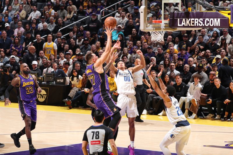 LOS ANGELES, CA - FEBRUARY 25: Luka Doncic #77 of the Los Angeles Lakers shoots the ball during the game against the Dallas Mavericks on February 25, 2025 at Crypto.Com Arena in Los Angeles, California. NOTE TO USER: User expressly acknowledges and agrees that, by downloading and/or using this Photograph, user is consenting to the terms and conditions of the Getty Images License Agreement. Mandatory Copyright Notice: Copyright 2025 NBAE (Photo by Nathaniel S. Butler/NBAE via Getty Images)