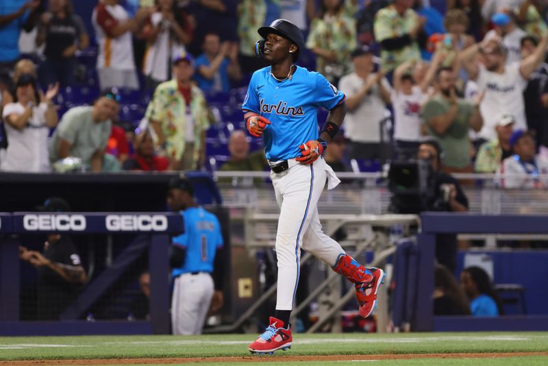 Jul 21, 2024; Miami, Florida, USA; Miami Marlins designated hitter Jazz Chisholm Jr. (2) circles the bases after hitting a three-run home run against the New York Mets during the fourth inning at loanDepot Park. Mandatory Credit: Sam Navarro-USA TODAY Sports