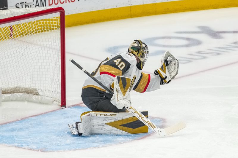 Nov 22, 2025; Anaheim, California, USA;  Vegas Golden Knights goaltender Akira Schmid (40) blocks a shot by Anaheim Ducks left wing Chris Kreider (20) during the second period at Honda Center. Mandatory Credit: Corinne Votaw-Imagn Images