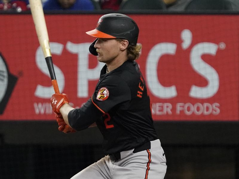 Jul 19, 2024; Arlington, Texas, USA; Baltimore Orioles shortstop Gunnar Henderson (2) hits a single during the seventh inning against the Texas Rangers at Globe Life Field. Mandatory Credit: Raymond Carlin III-USA TODAY Sports