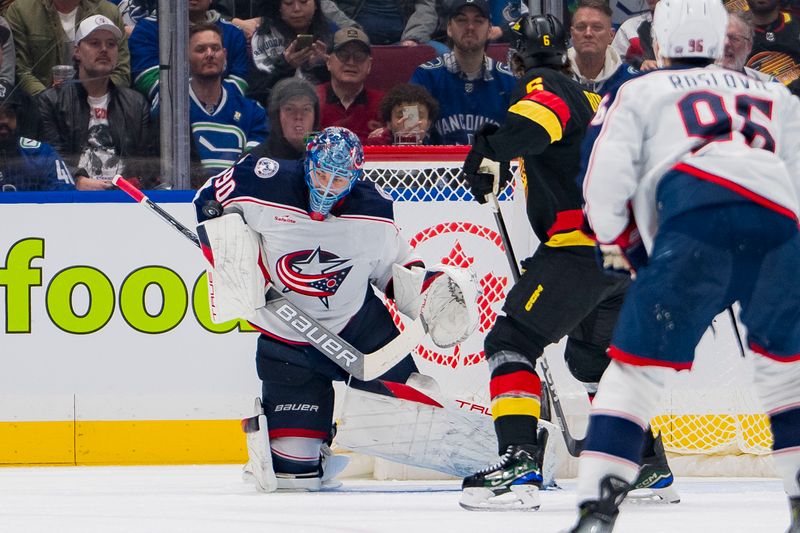 Jan 27, 2024; Vancouver, British Columbia, CAN; Vancouver Canucks forward Brock Boeser (6) watches as Columbus Blue Jackets goalie Elvis Merzlikins (90) makes a save in the first period at Rogers Arena. Mandatory Credit: Bob Frid-USA TODAY Sports