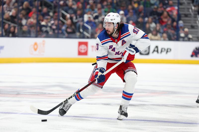 Mar 15, 2025; Columbus, Ohio, USA;  New York Rangers center Mika Zibanejad (93) skates the puck up ice during the third period against the Columbus Blue Jackets at Nationwide Arena. Mandatory Credit: Joseph Maiorana-Imagn Images