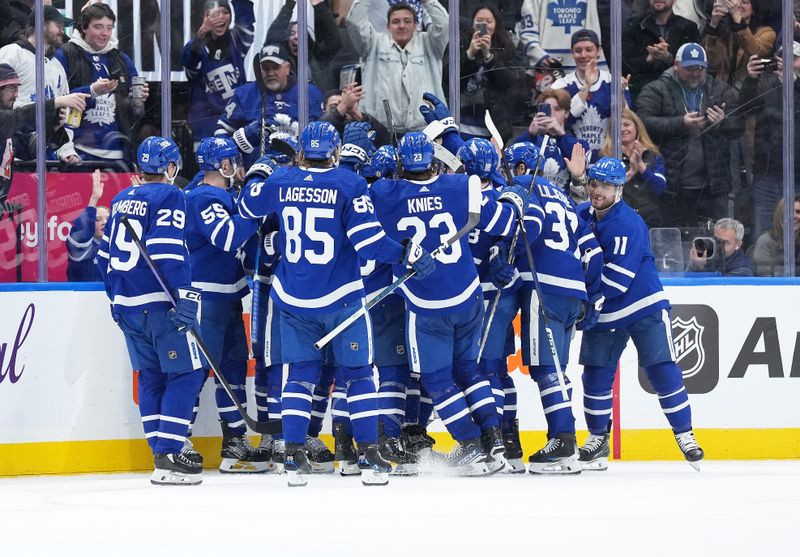 Feb 15, 2024; Toronto, Ontario, CAN; The Toronto Maple Leafs players celebrate the win after right wing William Nylander (88) (not pictured) scored the winning goal against the Philadelphia Flyers during the overtime period at Scotiabank Arena. Mandatory Credit: Nick Turchiaro-USA TODAY Sports