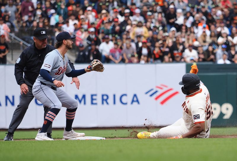 Aug 11, 2024; San Francisco, California, USA; San Francisco Giants designated hitter Jerar Encarnacion (59) slides safely to second base against Detroit Tigers second baseman Colt Keith (33) for a double against during the sixth inning at Oracle Park. Mandatory Credit: Kelley L Cox-USA TODAY Sports