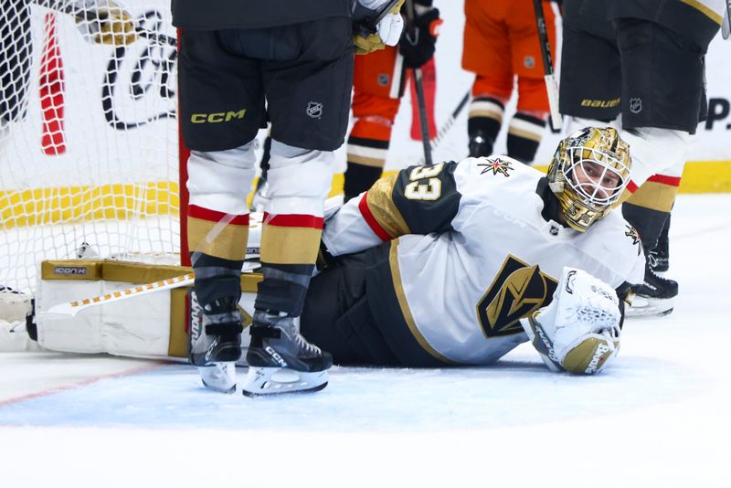 Nov 13, 2024; Anaheim, California, USA; Vegas Golden Knights goaltender Adin Hill (33) looks on after making a save during the second period of a hockey game against the Anaheim Ducks at Honda Center. Mandatory Credit: Jessica Alcheh-Imagn Images