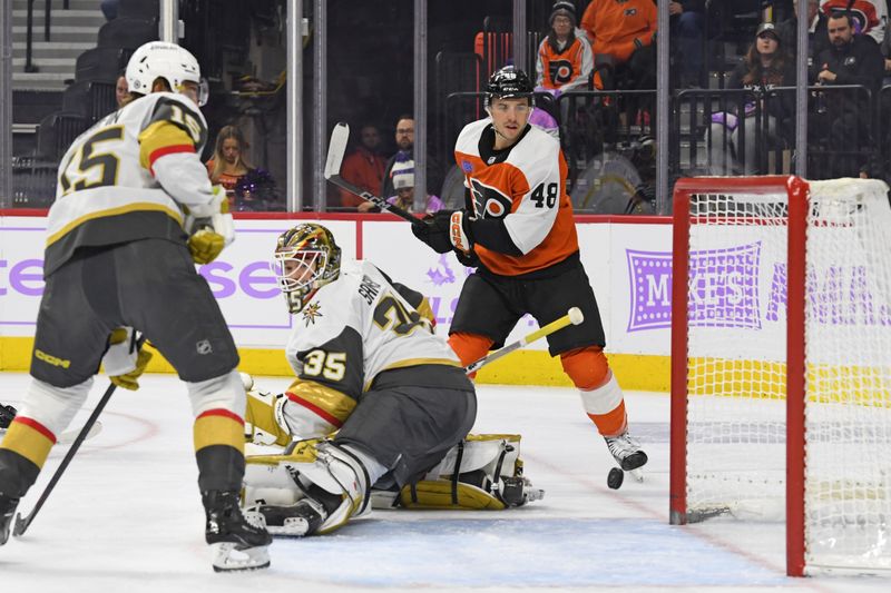 Nov 25, 2024; Philadelphia, Pennsylvania, USA; Philadelphia Flyers center Morgan Frost (48) celebrates his goal with against Vegas Golden Knights defenseman Noah Hanifin (15) and goaltender Ilya Samsonov (35) during the first period at Wells Fargo Center. Mandatory Credit: Eric Hartline-Imagn Images