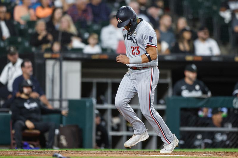 Sep 15, 2023; Chicago, Illinois, USA; Minnesota Twins third baseman Royce Lewis (23) scores against the Chicago White Sox during the fourth inning at Guaranteed Rate Field. Mandatory Credit: Kamil Krzaczynski-USA TODAY Sports