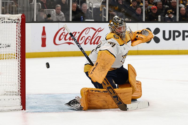 Jan 27, 2026; Boston, Massachusetts, USA; A shot by Boston Bruins defenseman Hampus Lindholm (27) gets past Nashville Predators goaltender Juuse Saros (74) for a goal during the first period at TD Garden. Mandatory Credit: Winslow Townson-Imagn Images