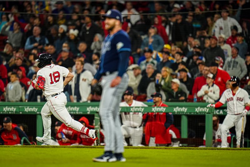 Sep 26, 2023; Boston, Massachusetts, USA; Boston Red Sox center fielder Adam Duvall (18) hits a double against  Tampa Bay Rays relief pitcher Colin Poche (38) in the seventh inning at Fenway Park. Mandatory Credit: David Butler II-USA TODAY Sports