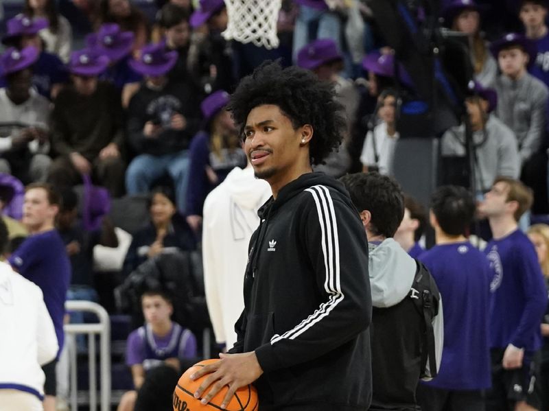 Jan 29, 2025; Evanston, Illinois, USA; Rutgers Scarlet Knights guard Dylan Harper (2) in a walking boot and is not playing against the Northwestern Wildcats at Welsh-Ryan Arena. Mandatory Credit: David Banks-Imagn Images