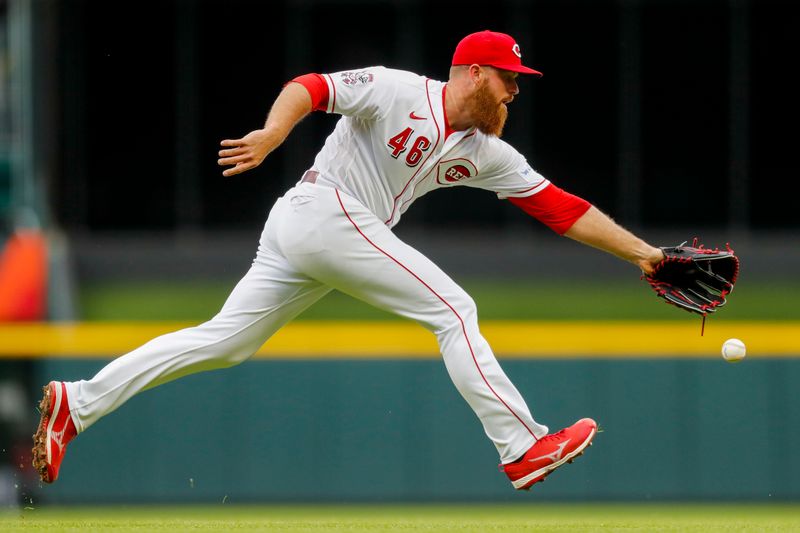 May 7, 2023; Cincinnati, Ohio, USA; Cincinnati Reds relief pitcher Buck Farmer (46) attempts to ground the ball hit by Chicago White Sox right fielder Adam Haseley (not pictured) in the seventh inning at Great American Ball Park. Mandatory Credit: Katie Stratman-USA TODAY Sports