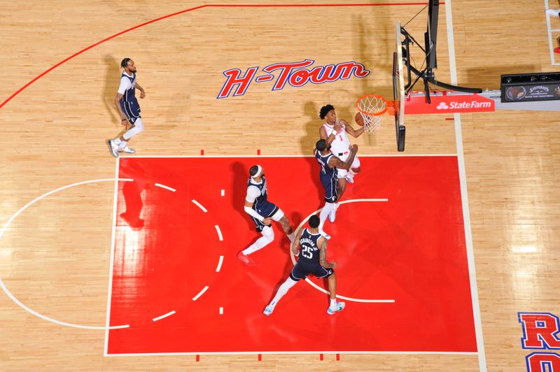 HOUSTON, TX - MARCH 31: Amen Thompson #1 of the Houston Rockets handles the ball during the game against the Dallas Mavericks on March 31, 2024 at the Toyota Center in Houston, Texas. NOTE TO USER: User expressly acknowledges and agrees that, by downloading and or using this photograph, User is consenting to the terms and conditions of the Getty Images License Agreement. Mandatory Copyright Notice: Copyright 2024 NBAE (Photo by Logan Riely/NBAE via Getty Images)