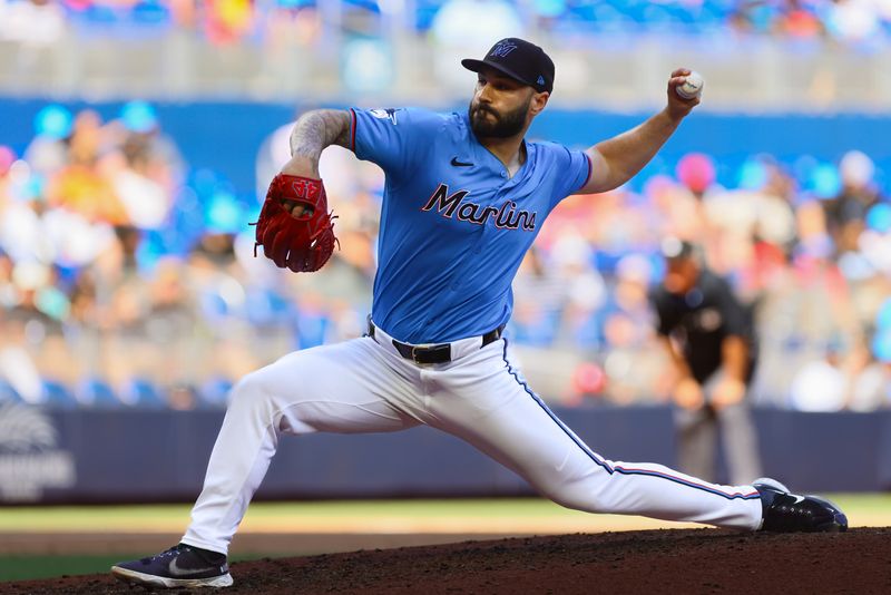 Apr 14, 2024; Miami, Florida, USA; Miami Marlins relief pitcher Tanner Scott (66) delivers a pitch against the Atlanta Braves during the ninth inning at loanDepot Park. Mandatory Credit: Sam Navarro-USA TODAY Sports