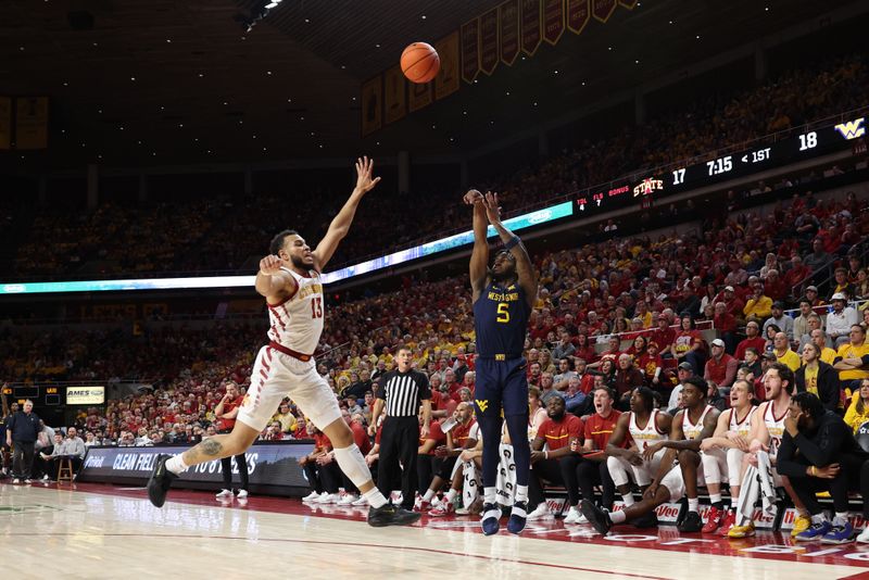 Feb 27, 2023; Ames, Iowa, USA; West Virginia Mountaineers guard Joe Toussaint (5) shoots over Iowa State Cyclones guard Jaren Holmes (13) during the first half at James H. Hilton Coliseum. Mandatory Credit: Reese Strickland-USA TODAY Sports