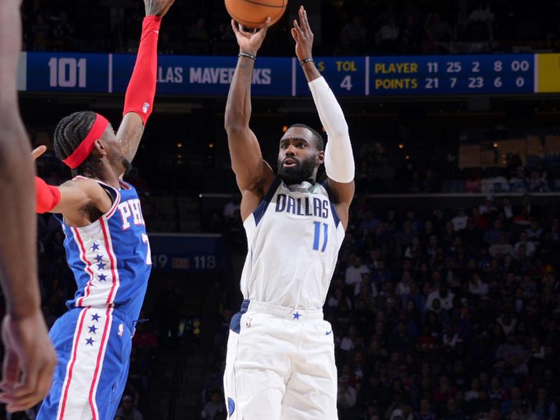 PHILADELPHIA, PA - MARCH 29: Tim Hardaway Jr. #11 of the Dallas Mavericks shoots a three point basket during the game against the Philadelphia 76ers on March 29, 2023 at the Wells Fargo Center in Philadelphia, Pennsylvania NOTE TO USER: User expressly acknowledges and agrees that, by downloading and/or using this Photograph, user is consenting to the terms and conditions of the Getty Images License Agreement. Mandatory Copyright Notice: Copyright 2023 NBAE (Photo by Jesse D. Garrabrant/NBAE via Getty Images)