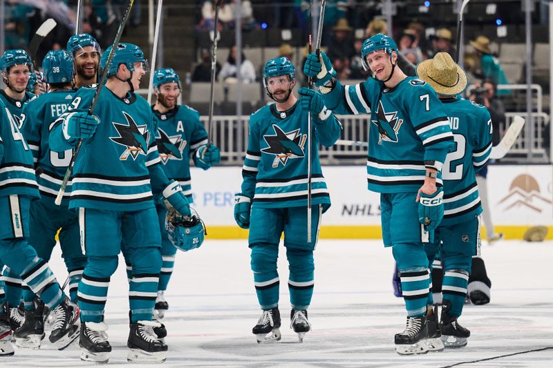 Apr 6, 2024; San Jose, California, USA; San Jose Sharks players salute their fans after defeating the St. Louis Blues during the overtime period at SAP Center at San Jose. Mandatory Credit: Robert Edwards-USA TODAY Sports