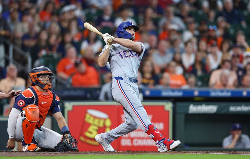 Jul 14, 2024; Houston, Texas, USA; Texas Rangers third baseman Josh Smith (8) hits a two-run home run during the first inning against the Houston Astros at Minute Maid Park. Mandatory Credit: Troy Taormina-USA TODAY Sports