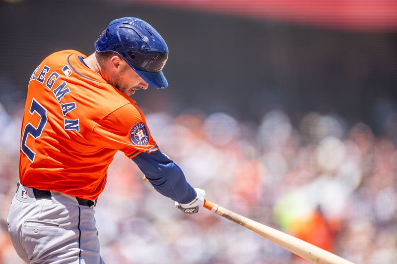 Jun 12, 2024; San Francisco, California, USA;  Houston Astros third base Alex Bregman (2) hits a single during the sixth inning against the San Francisco Giants at Oracle Park. Mandatory Credit: Bob Kupbens-USA TODAY Sports