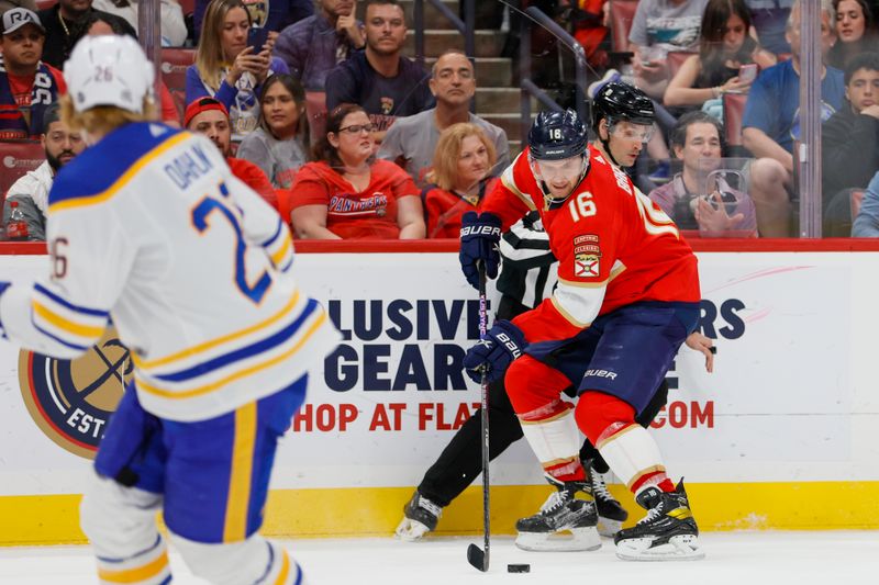 Apr 4, 2023; Sunrise, Florida, USA; Florida Panthers center Aleksander Barkov (16) moves the puck during the second period against the Buffalo Sabres at FLA Live Arena. Mandatory Credit: Sam Navarro-USA TODAY Sports