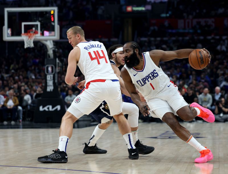 LOS ANGELES, CALIFORNIA - APRIL 04: James Harden #1 of the LA Clippers dribbles around a screen set by Mason Plumlee #44 on Aaron Gordon #50 of the Denver Nuggets during the first half at Crypto.com Arena on April 04, 2024 in Los Angeles, California. User is consenting to the terms and conditions of the Getty Images License Agreement. (Photo by Harry How/Getty Images)