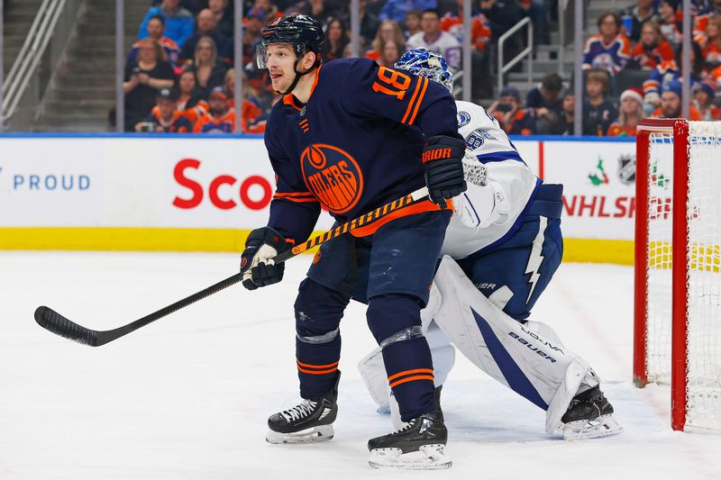 Dec 14, 2023; Edmonton, Alberta, CAN; Edmonton Oilers forward Zach Hyman (18) tries to screen Tampa Bay Lightning goaltender Andrei Vasilevskiy (88) during the first period at Rogers Place. Mandatory Credit: Perry Nelson-USA TODAY Sports