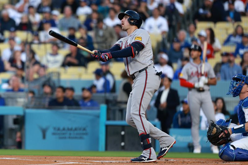 May 3, 2024; Los Angeles, California, USA;  Atlanta Braves third base Austin Riley (27) hits a home run in the first inning against the Los Angeles Dodgers at Dodger Stadium. Mandatory Credit: Kiyoshi Mio-USA TODAY Sports