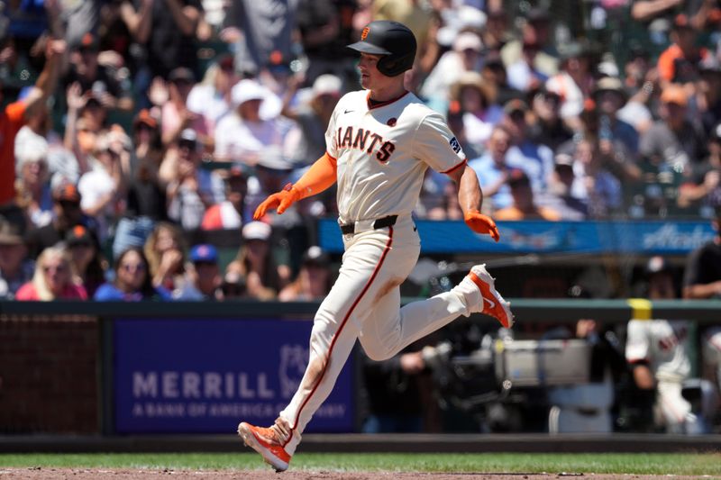 Jun 27, 2024; San Francisco, California, USA; San Francisco Giants third baseman Matt Chapman (26) scores on a wild pitch against the Chicago Cubs during the sixth inning at Oracle Park. Mandatory Credit: Darren Yamashita-USA TODAY Sports