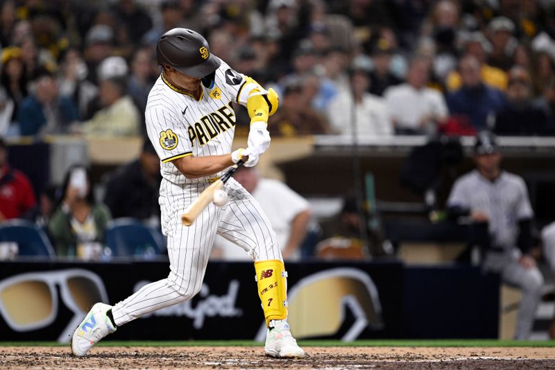 May 13, 2024; San Diego, California, USA; San Diego Padres shortstop Ha-Seong Kim (7) hits a single against the Colorado Rockies during the fifth inning at Petco Park. Mandatory Credit: Orlando Ramirez-USA TODAY Sports