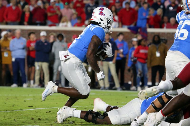 Oct 7, 2023; Oxford, Mississippi, USA; Mississippi Rebels running back Quinshon Judkins (4) runs with the ball for a touchdown during the first quarter against the Arkansas Razorbacks at Vaught-Hemingway Stadium. Mandatory Credit: Petre Thomas-USA TODAY Sports