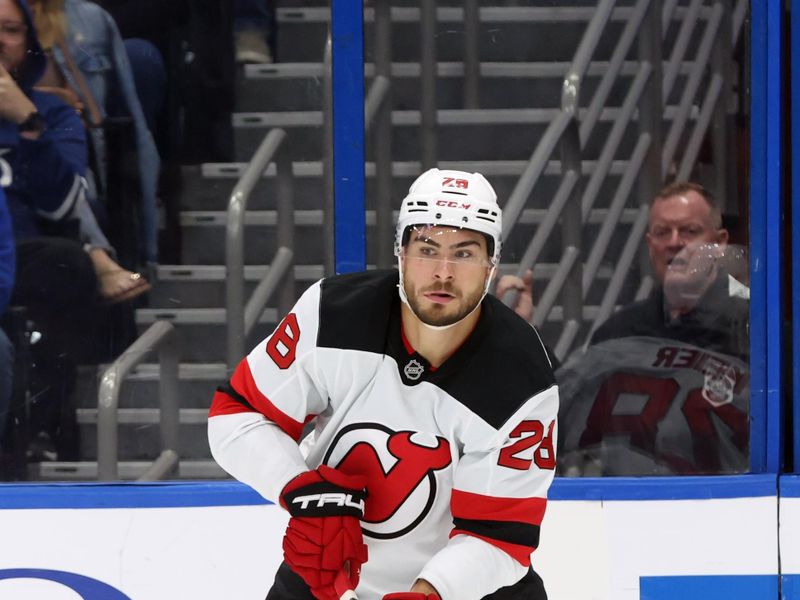 Oct 11, 2025; Tampa, Florida, USA; New Jersey Devils right wing Timo Meier (28) skates with the puck against the Tampa Bay Lightning during the second period at Benchmark International Arena. Mandatory Credit: Kim Klement Neitzel-Imagn Images