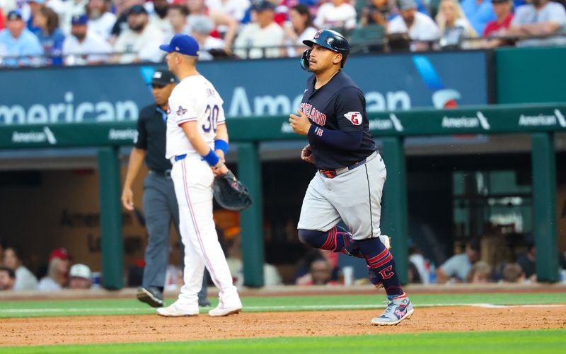 May 14, 2024; Arlington, Texas, USA;  Cleveland Guardians first base Josh Naylor (22) rounds the bases past Texas Rangers first base Nathaniel Lowe (30) after hitting a three-run home run during the second inning at Globe Life Field. Mandatory Credit: Kevin Jairaj-USA TODAY Sports