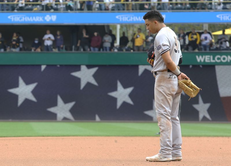 Sep 17, 2023; Pittsburgh, Pennsylvania, USA;  New York Yankees third baseman Oswald Peraza (91) stands for the playing of God Bless America against the Pittsburgh Pirates during the seventh inning stretch at PNC Park. Pittsburgh won 3-2. Mandatory Credit: Charles LeClaire-USA TODAY Sports