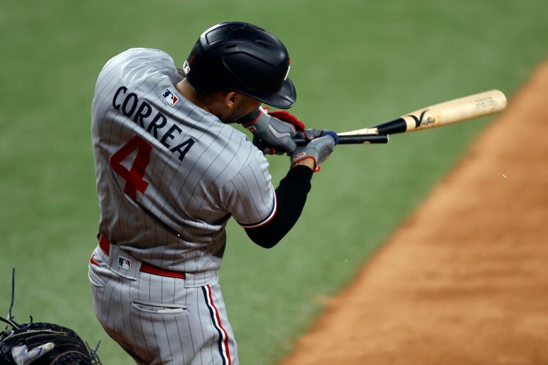 Sep 2, 2023; Arlington, Texas, USA; Minnesota Twins shortstop Carlos Correa (4) breaks his bat in the seventh inning against the Texas Rangers at Globe Life Field. Mandatory Credit: Tim Heitman-USA TODAY Sports