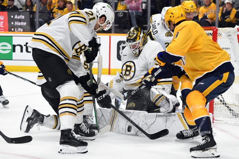 Apr 2, 2024; Nashville, Tennessee, USA; Boston Bruins goaltender Linus Ullmark (35) makes a save in traffic after a shot by Nashville Predators center Cody Glass (8) during the third period at Bridgestone Arena. Mandatory Credit: Christopher Hanewinckel-USA TODAY Sports