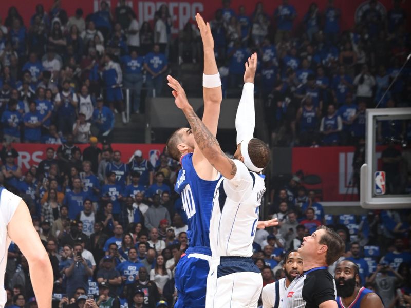 LOS ANGELES, CA - APRIL 21: The opening tip off during the game between the Dallas Mavericks and the LA Clippers during the 2024 NBA Playoffs on April 21, 2024 at Crypto.Com Arena in Los Angeles, California. NOTE TO USER: User expressly acknowledges and agrees that, by downloading and/or using this Photograph, user is consenting to the terms and conditions of the Getty Images License Agreement. Mandatory Copyright Notice: Copyright 2024 NBAE (Photo by Andrew D. Bernstein/NBAE via Getty Images)