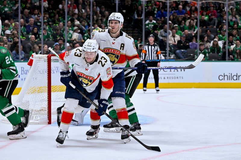 Mar 12, 2024; Dallas, Texas, USA; Florida Panthers center Carter Verhaeghe (23) and left wing Matthew Tkachuk (19) skates against the Dallas Stars during the third period at the American Airlines Center. Mandatory Credit: Jerome Miron-USA TODAY Sports