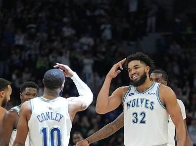 MINNEAPOLIS, MN -  DECEMBER 16: Karl-Anthony Towns #32 and Mike Conley #10 of the Minnesota Timberwolves celebrate during the game against the Indiana Pacers on December 16, 2023 at Target Center in Minneapolis, Minnesota. NOTE TO USER: User expressly acknowledges and agrees that, by downloading and or using this Photograph, user is consenting to the terms and conditions of the Getty Images License Agreement. Mandatory Copyright Notice: Copyright 2023 NBAE (Photo by Jordan Johnson/NBAE via Getty Images)