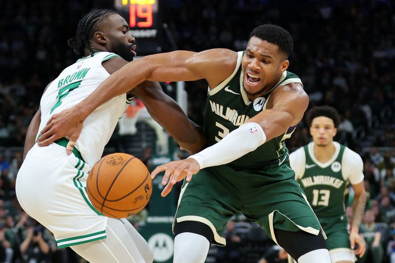 MILWAUKEE, WISCONSIN - NOVEMBER 10: Giannis Antetokounmpo #34 of the Milwaukee Bucks is defended by Jaylen Brown #7 of the Boston Celtics during the first half of a game at Fiserv Forum on November 10, 2024 in Milwaukee, Wisconsin. NOTE TO USER: User expressly acknowledges and agrees that, by downloading and or using this photograph, User is consenting to the terms and conditions of the Getty Images License Agreement. (Photo by Stacy Revere/Getty Images)