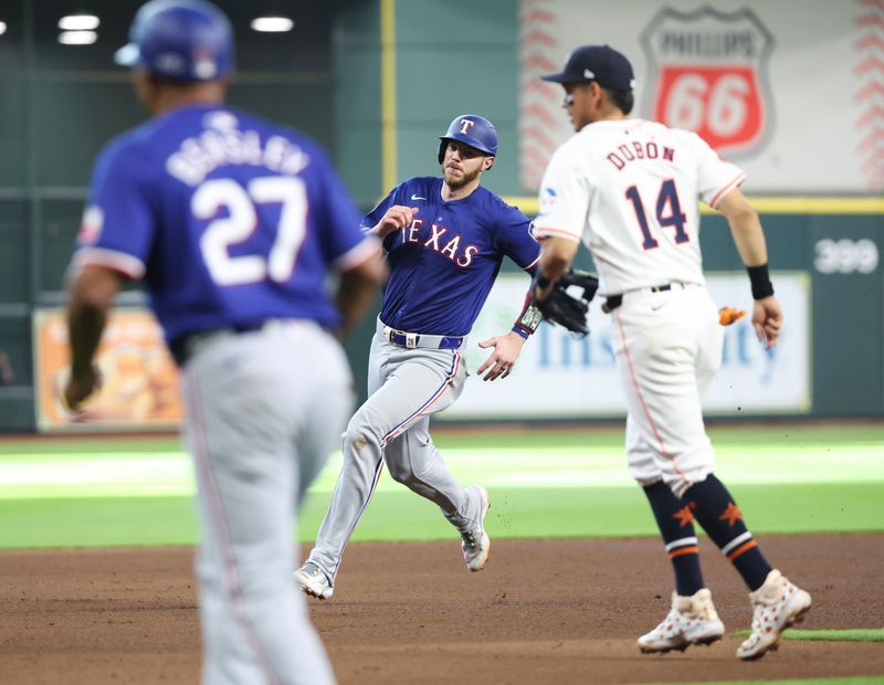 Apr 13, 2024; Houston, Texas, USA; Texas Rangers catcher Jonah Heim (28) runs from second to third base against the Houston Astros in the seventh inning at Minute Maid Park. Mandatory Credit: Thomas Shea-USA TODAY Sports