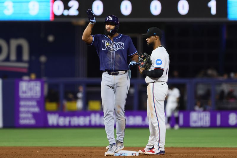 Jun 5, 2024; Miami, Florida, USA; Tampa Bay Rays third baseman Amed Rosario (10) reacts from second base after hitting a double against the Miami Marlins during the eighth inning at loanDepot Park. Mandatory Credit: Sam Navarro-USA TODAY Sports