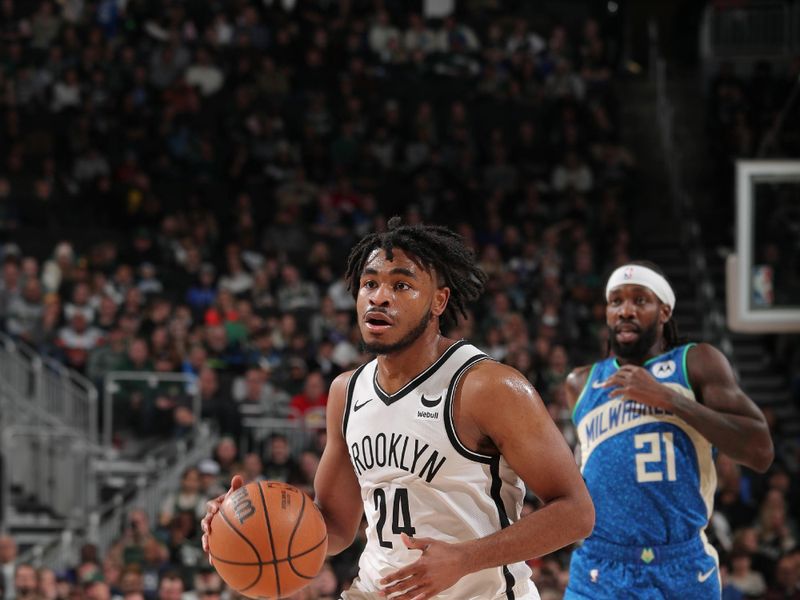 MILWAUKEE, WI - MARCH 21: Cam Thomas #24 of the Brooklyn Nets drives to the basket during the game against the Milwaukee Bucks on March 21, 2024 at the Fiserv Forum Center in Milwaukee, Wisconsin. NOTE TO USER: User expressly acknowledges and agrees that, by downloading and or using this Photograph, user is consenting to the terms and conditions of the Getty Images License Agreement. Mandatory Copyright Notice: Copyright 2024 NBAE (Photo by Gary Dineen/NBAE via Getty Images).