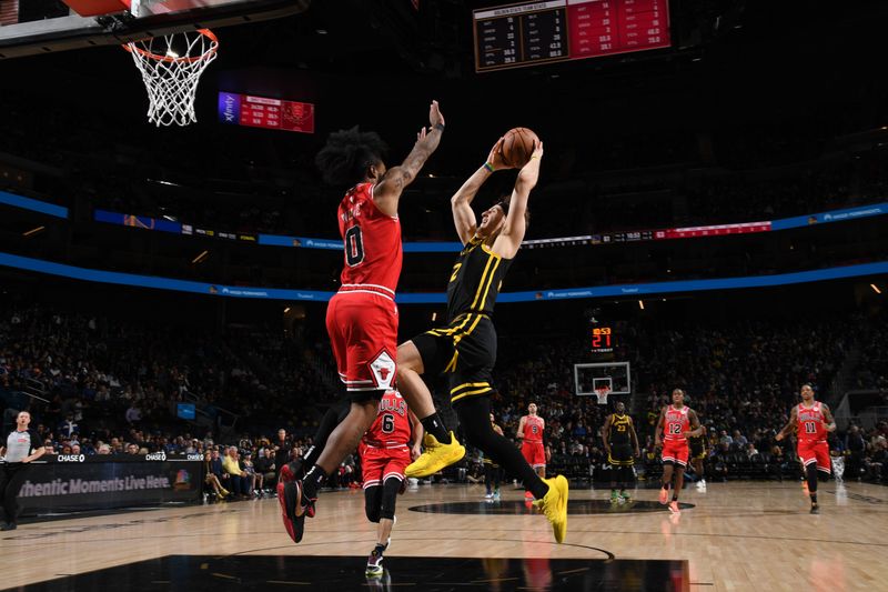 SAN FRANCISCO, CA - MARCH 7: Brandin Podziemski #2 of the Golden State Warriors drives to the basket during the game against the Chicago Bulls on March 7, 2024 at Chase Center in San Francisco, California. NOTE TO USER: User expressly acknowledges and agrees that, by downloading and or using this photograph, user is consenting to the terms and conditions of Getty Images License Agreement. Mandatory Copyright Notice: Copyright 2024 NBAE (Photo by Noah Graham/NBAE via Getty Images)