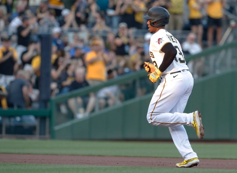 Aug 26, 2023; Pittsburgh, Pennsylvania, USA;  Pittsburgh Pirates third baseman Ke'Bryan Hayes (13) circles the bases on a solo home run against the Chicago Cubs during the first inning at PNC Park. Mandatory Credit: Charles LeClaire-USA TODAY Sports