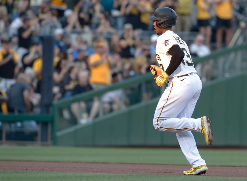 Aug 26, 2023; Pittsburgh, Pennsylvania, USA;  Pittsburgh Pirates third baseman Ke'Bryan Hayes (13) circles the bases on a solo home run against the Chicago Cubs during the first inning at PNC Park. Mandatory Credit: Charles LeClaire-USA TODAY Sports