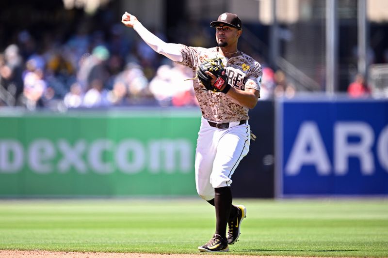 Apr 28, 2024; San Diego, California, USA; San Diego Padres second baseman Xander Bogaerts (2) throws to first base on a ground out by Philadelphia Phillies designated hitter Kyle Schwarber (not pictured) during the fifth inning at Petco Park. Mandatory Credit: Orlando Ramirez-USA TODAY Sports