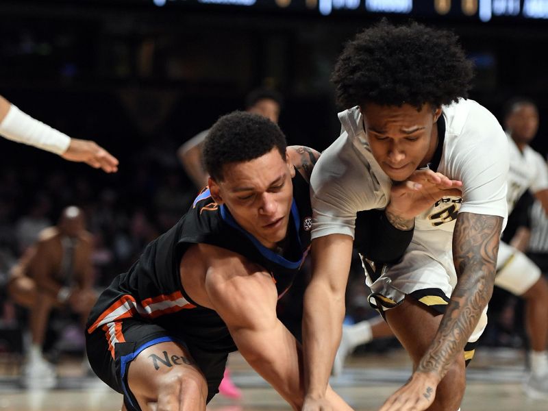 Mar 9, 2024; Nashville, Tennessee, USA; Florida Gators guard Riley Kugel (2) and Vanderbilt Commodores guard Paul Lewis (3) work for a loose ball during the first half at Memorial Gymnasium. Mandatory Credit: Christopher Hanewinckel-USA TODAY Sports