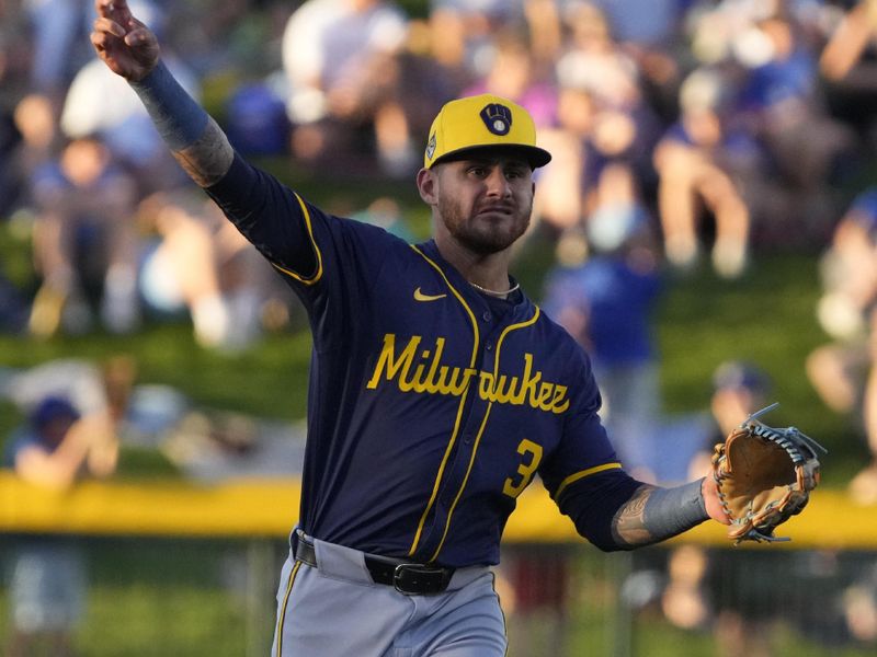 Mar 12, 2024; Mesa, Arizona, USA; Milwaukee Brewers second baseman Joey Ortiz (3) warms up before a game against the Chicago Cubs at Sloan Park. Mandatory Credit: Rick Scuteri-USA TODAY Sports