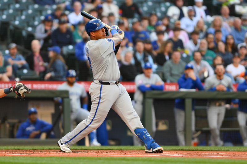 May 14, 2024; Seattle, Washington, USA; Kansas City Royals catcher Salvador Perez (13) hits a single against the Seattle Mariners during the second inning at T-Mobile Park. Mandatory Credit: Steven Bisig-USA TODAY Sports